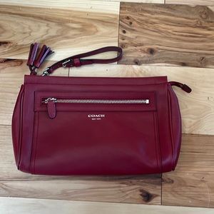 Coach burgundy clutch - hardly used. Like new. Rare color.